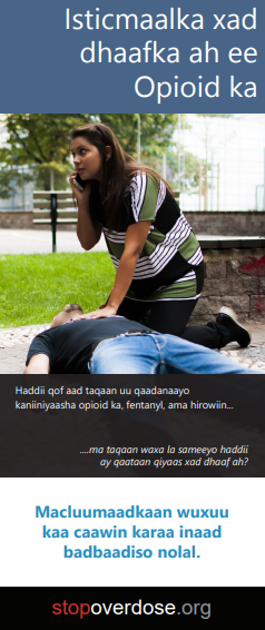 Brochure cover showing a woman kneeling on the ground next to an unconscious man. One of her hands is resting on his chest, the other holding a phone to her ear. Title is Opioid Overdose (in Somali).