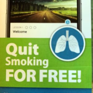 quits-smoking-free Front of wallet card showing a smart phone with a green banner that reads Quit smoking for free!