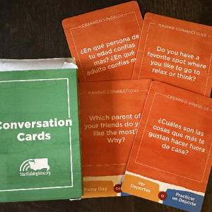 start-talking-now-conversation-cards Green card box next to several of the cards, which feature orange backgrounds with white text