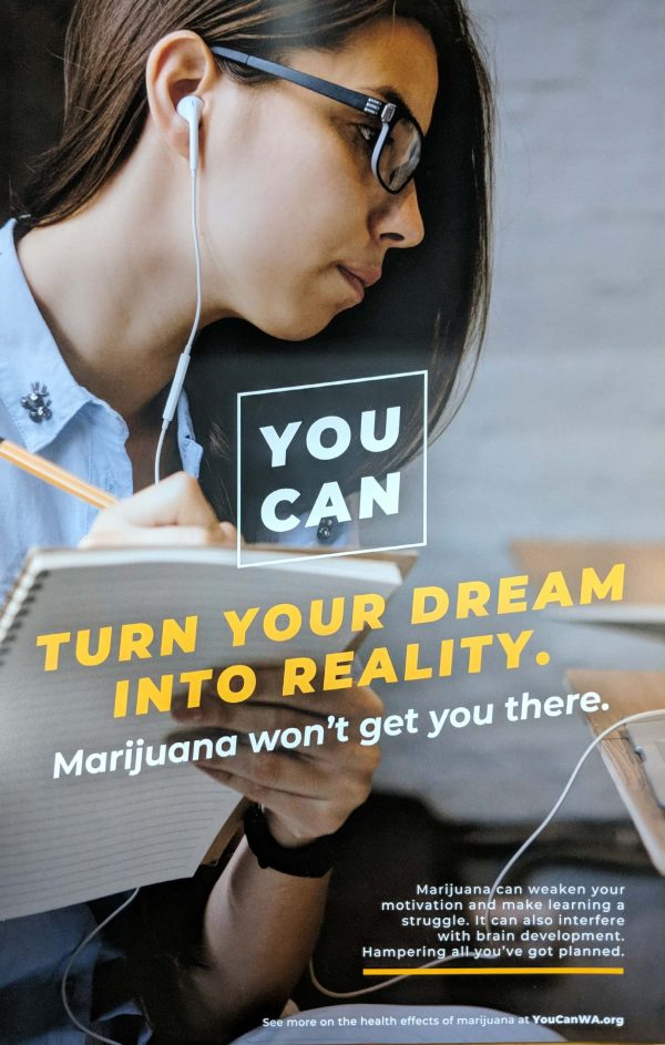 Photo of a student taking notes with ear buds in and the text YOU CAN turn your dream into reality