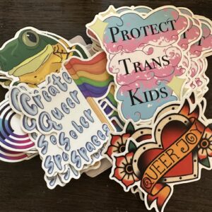 Includes a mix of stickers that feature messages like “Protect Trans Kids,” “Queer Joy,” and “Queer Sober Spaces.” Approximately 80 stickers per pack.